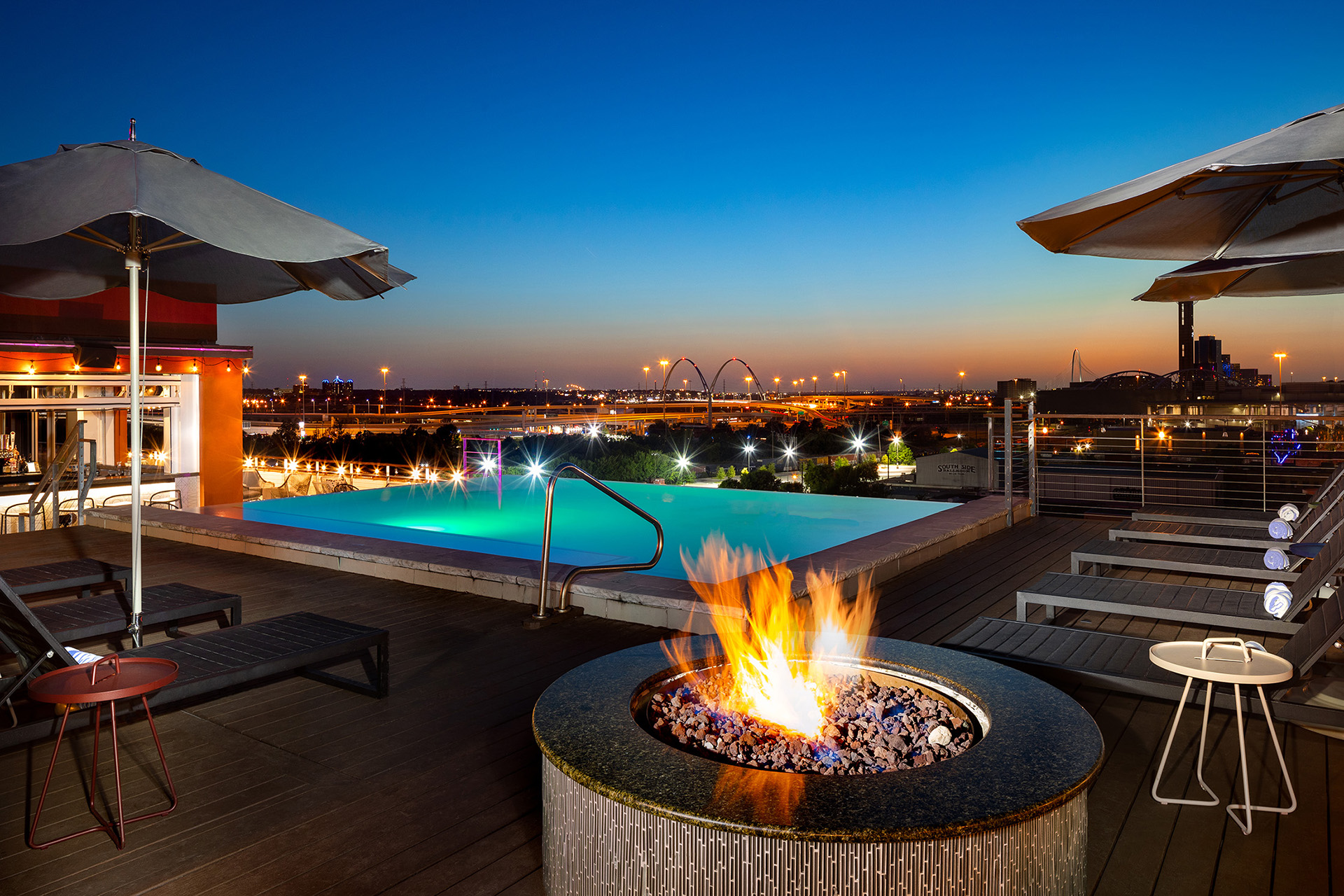 Gallery rooftop with lounge seating and outside view of Dallas Skyline
